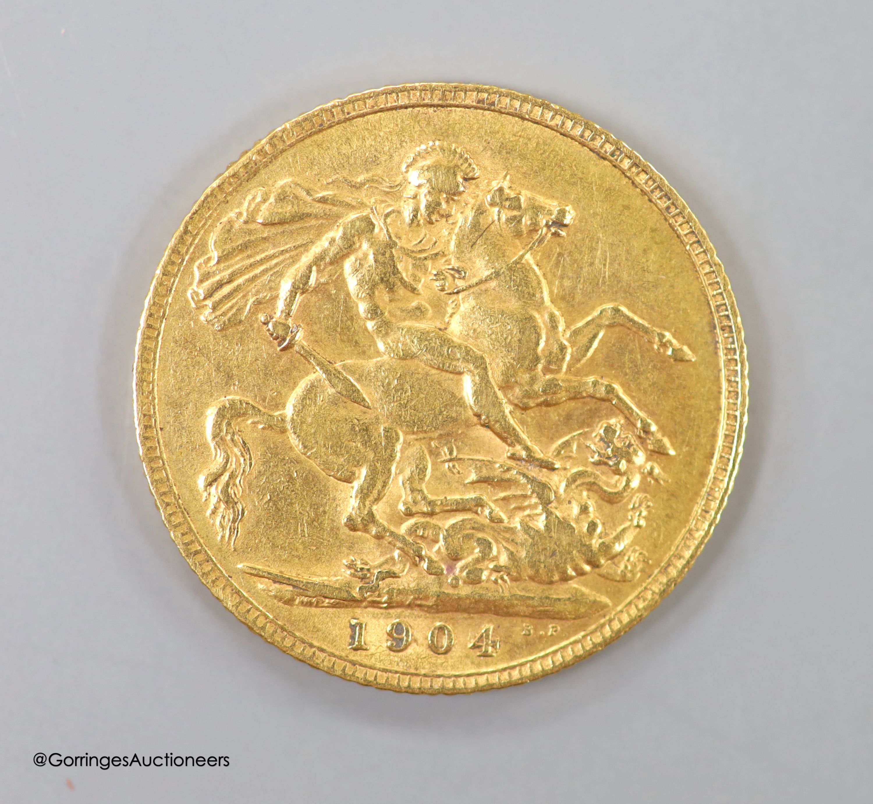 An Edward VII 1904 gold sovereign.